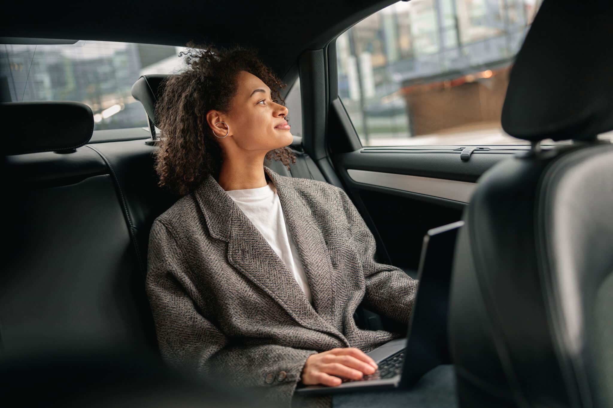 Passenger enjoying a quiet ride in a luxury vehicle